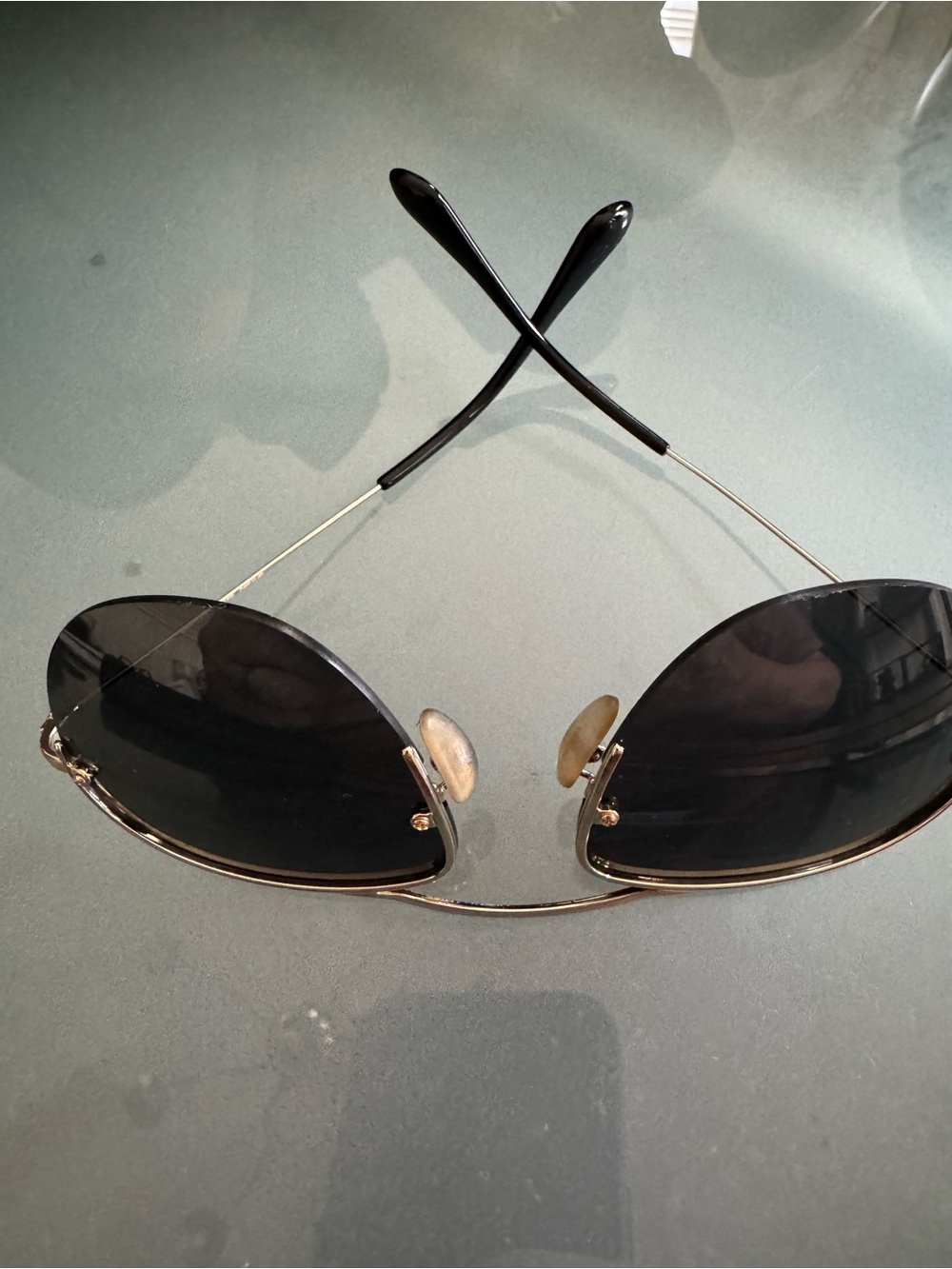 Prada Men’s Black Temples with Gold Accents Rimless Sunglasses - Picture 2 of 7